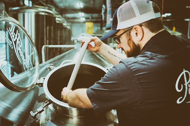 Working in the brewery at the Pigeon Hill production facility in Muskegon, MI