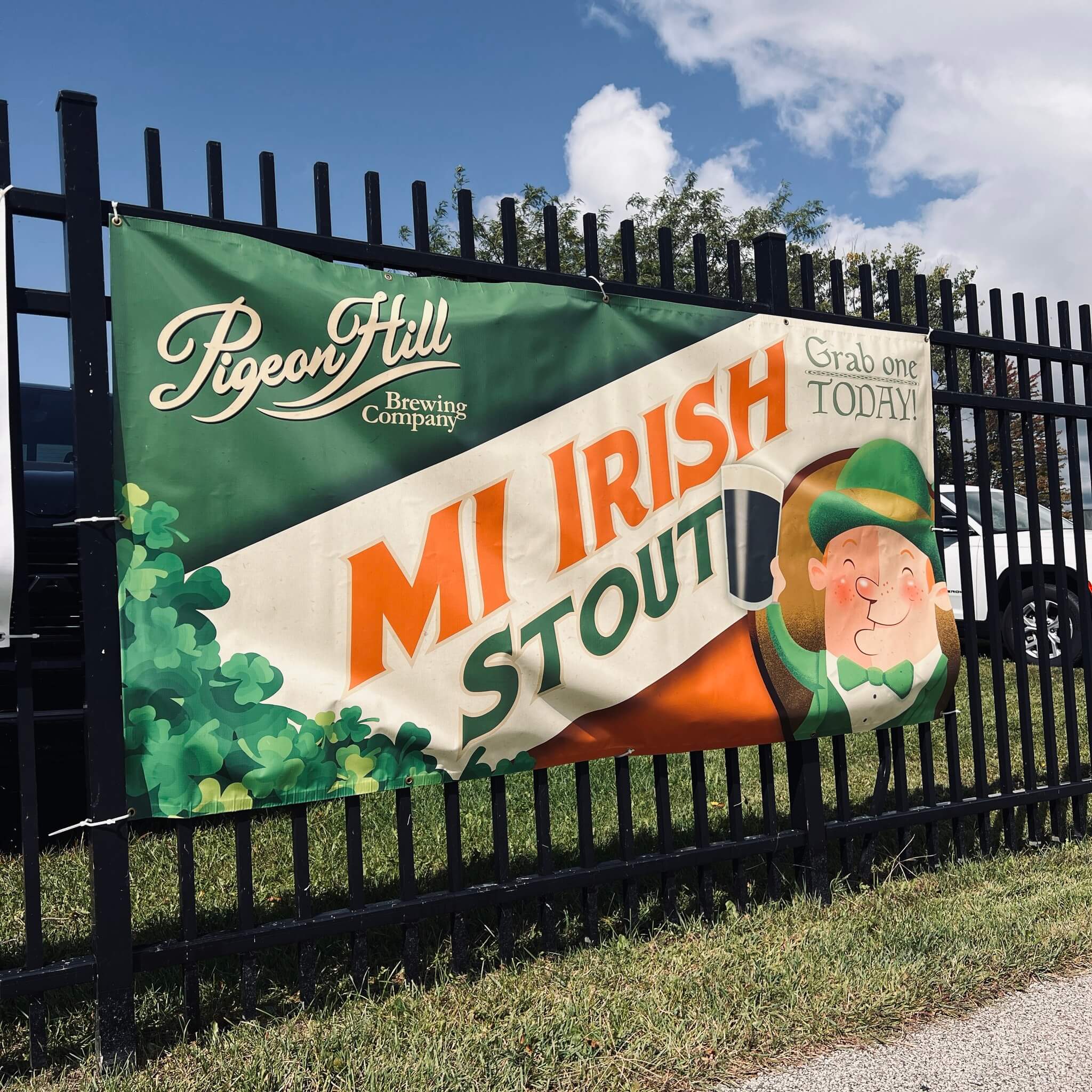 Banner advertising Pigeon Hill's MI Irish Stout outside of the Michigan Irish Music Festival.