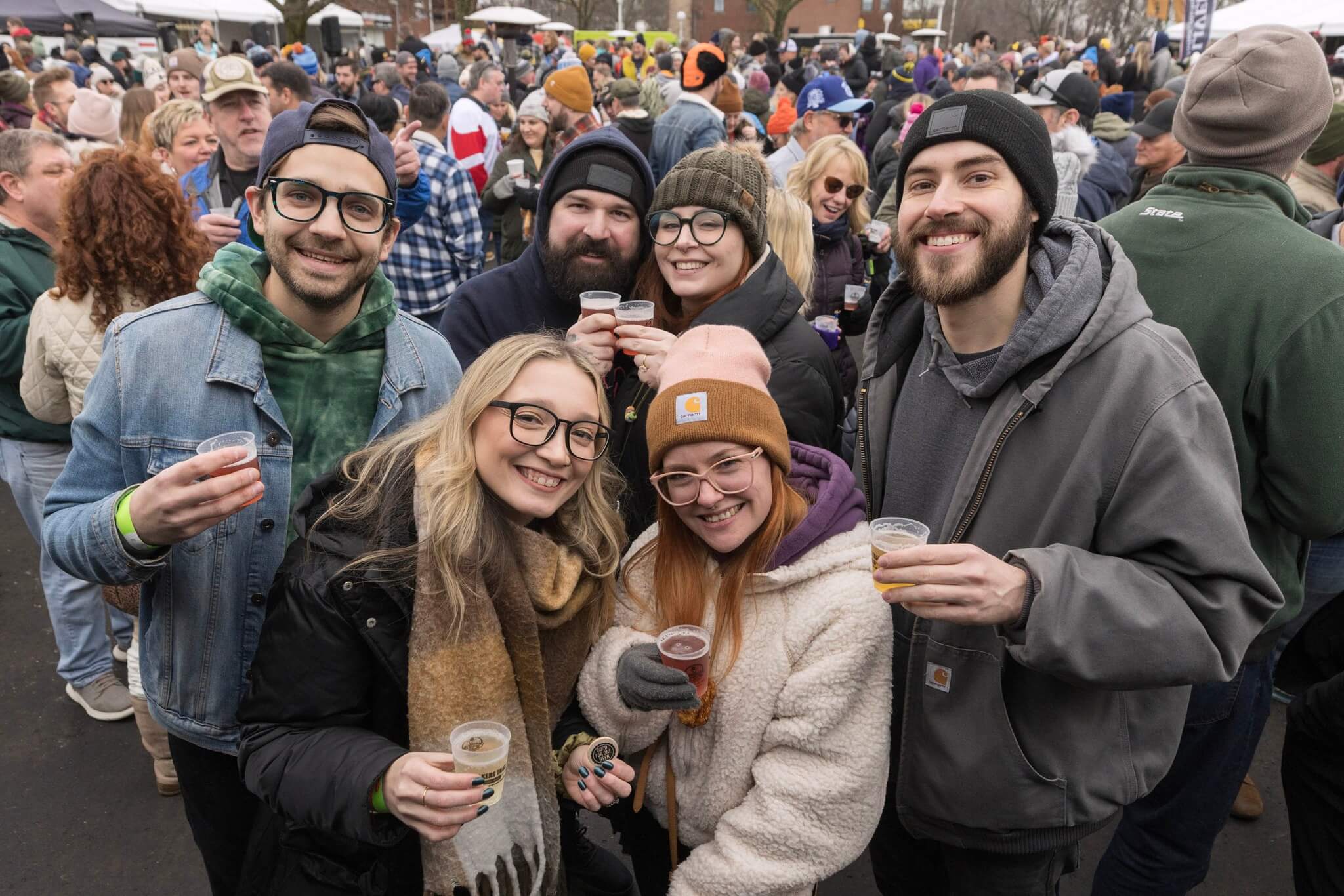 A group of people enjoying craft beer at the St. Joe Winter Beer Fest.