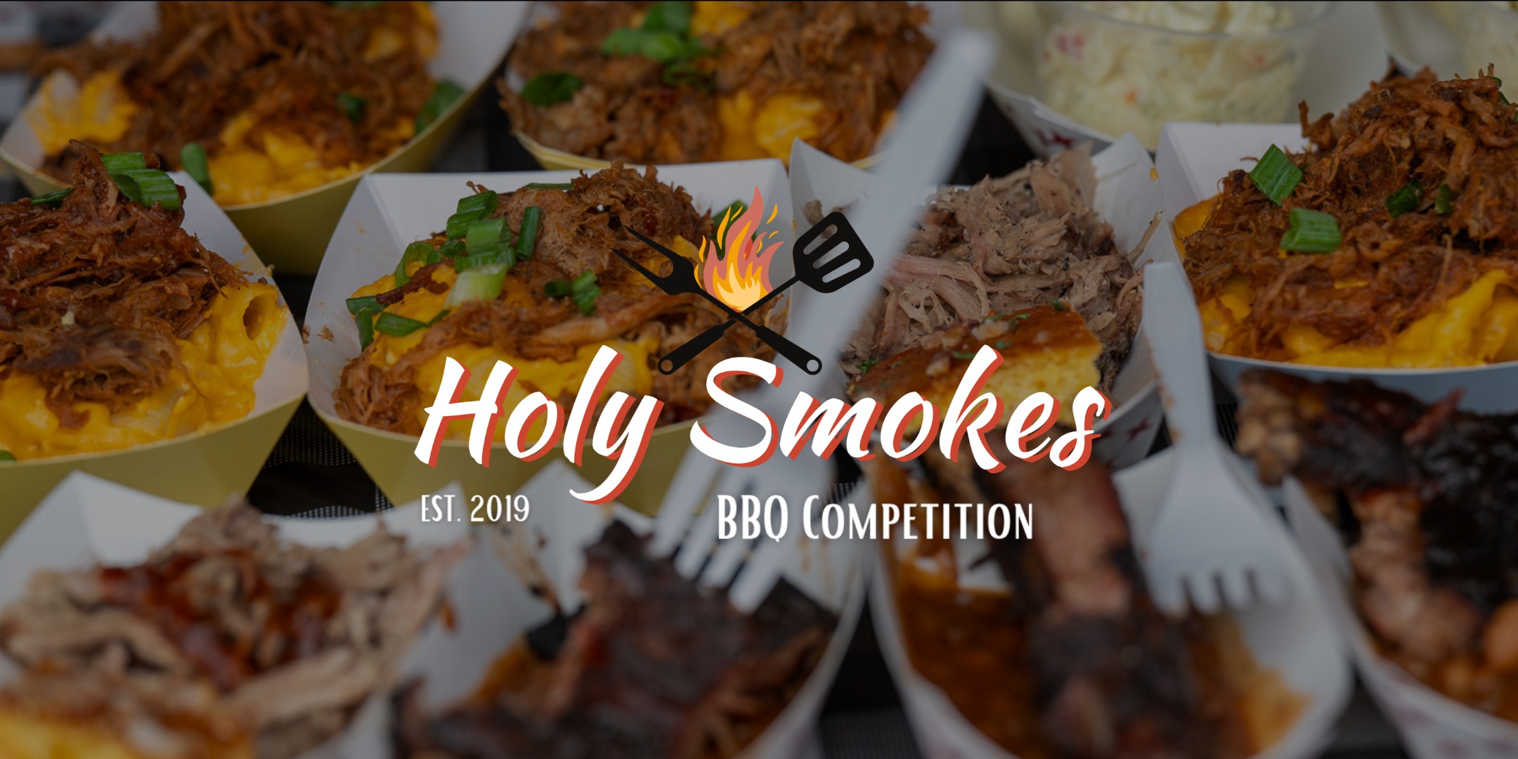 Banner advertising Holy Smokes BBQ Competition in Muskegon on May 16 at Pigeon Hill